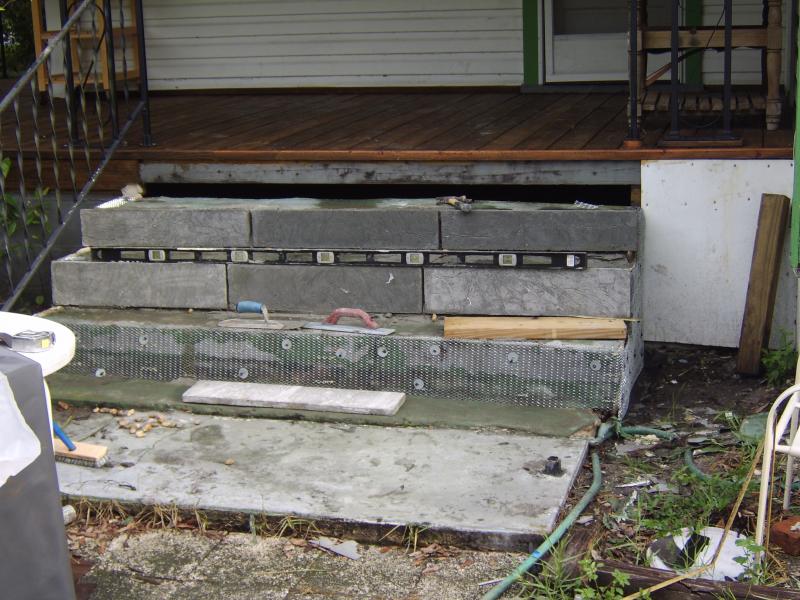 cracked and broken concrete steps in need of repair